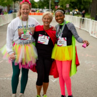 South Bend 5K volunteer Sparkle Runners pose at the finish line